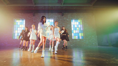 a group of young women in short white dresses