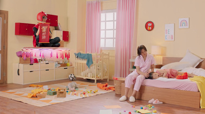 a woman sitting on a bed in a bedroom