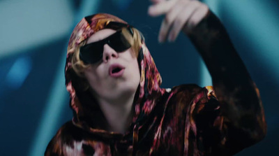 a man with sunglasses and a hoodie on