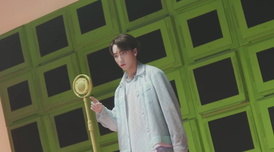 a man standing next to a pole with a mirror on it