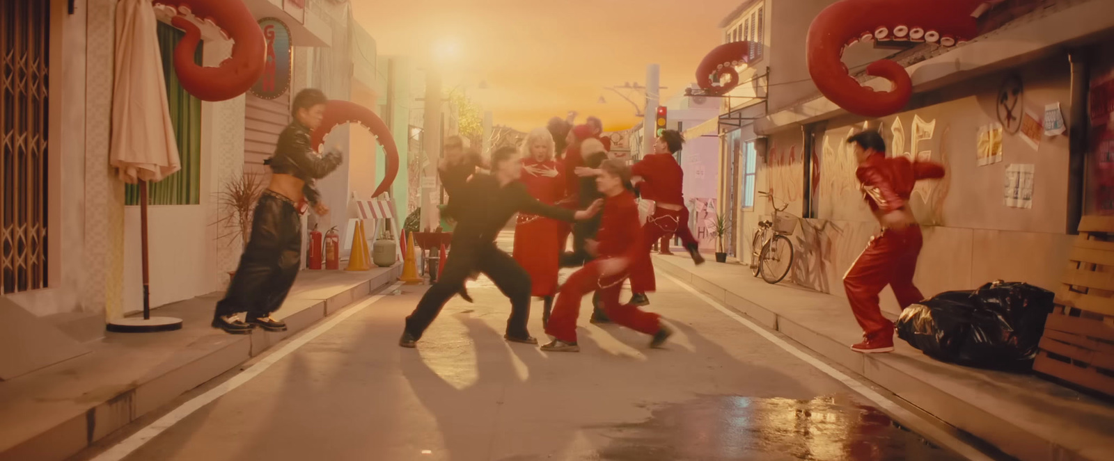 a group of people dancing on a city street