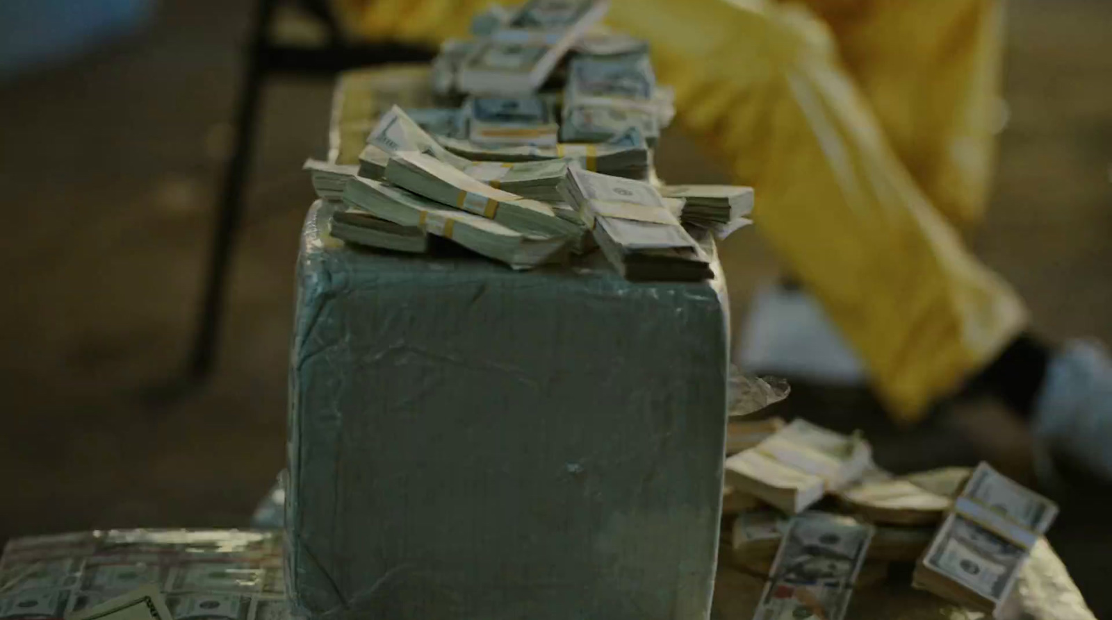 a stack of money sitting on top of a table