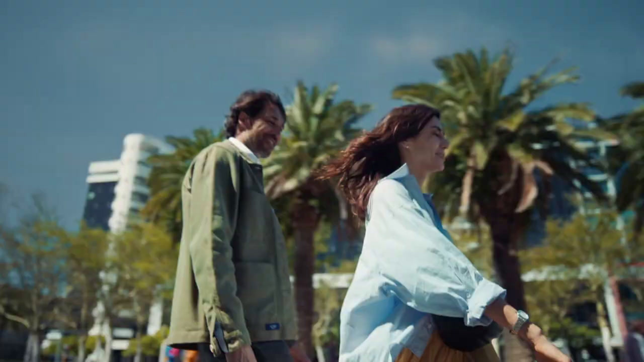 a man and a woman walking down a street