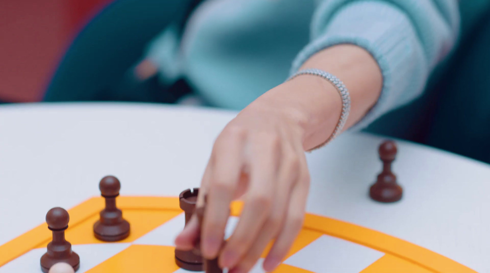 a close up of a person playing a game of chess