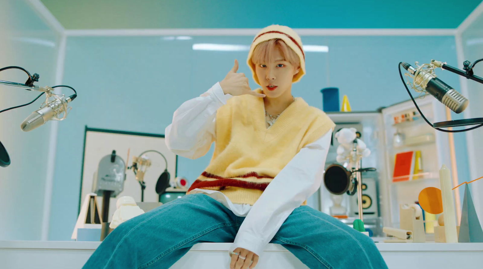 a woman sitting on top of a counter in a room