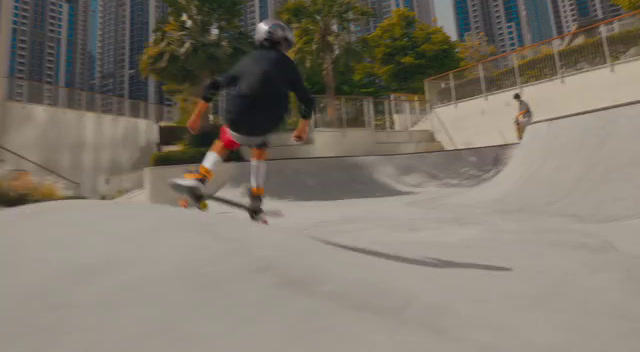 a man riding a skateboard down the side of a ramp