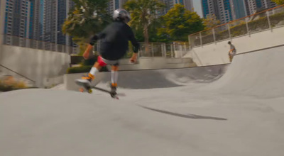 a man riding a skateboard down the side of a ramp