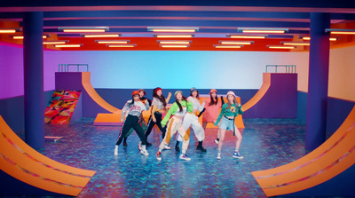 a group of girls standing on top of a stage