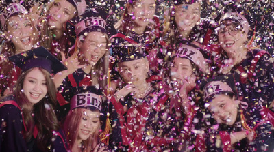 a group of people standing next to each other under confetti