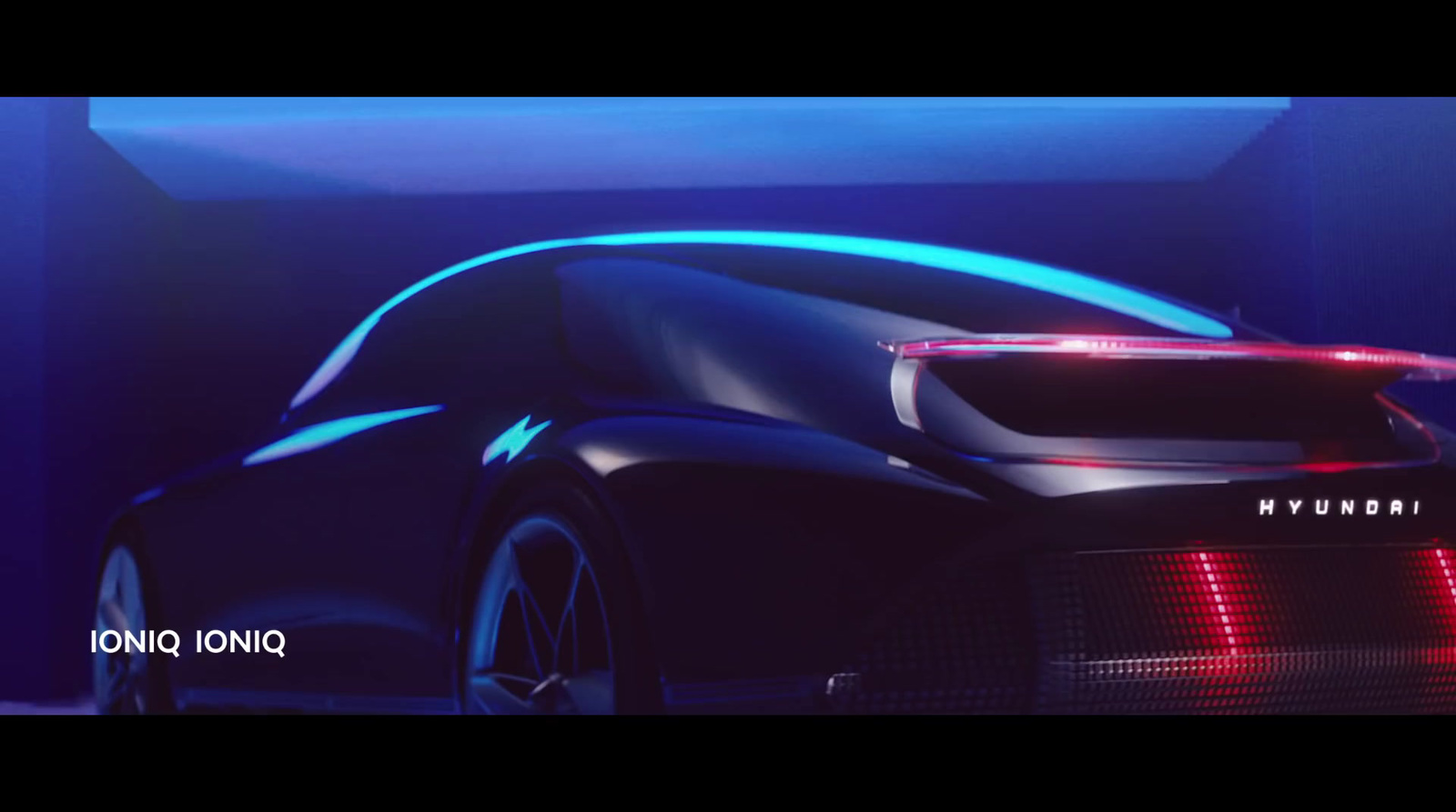 a futuristic car is shown in a dark room