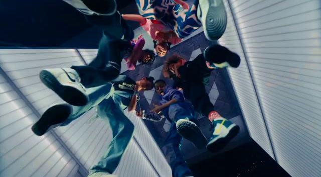 a group of young men riding skateboards on top of a ramp