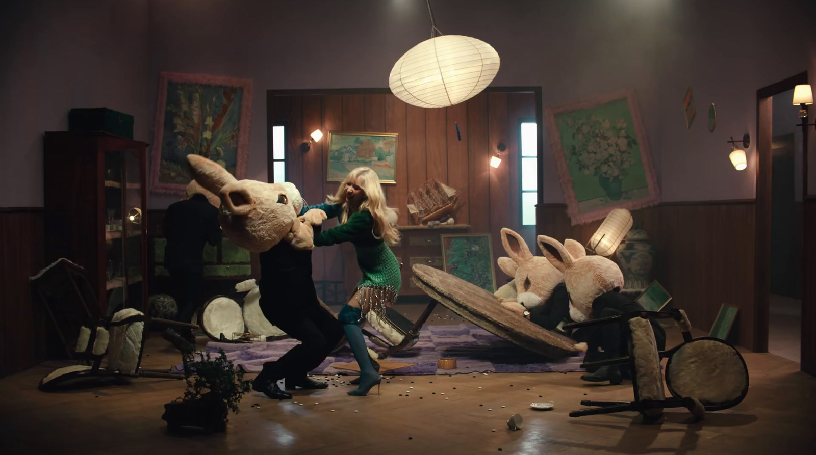 a woman dancing with stuffed animals in a room