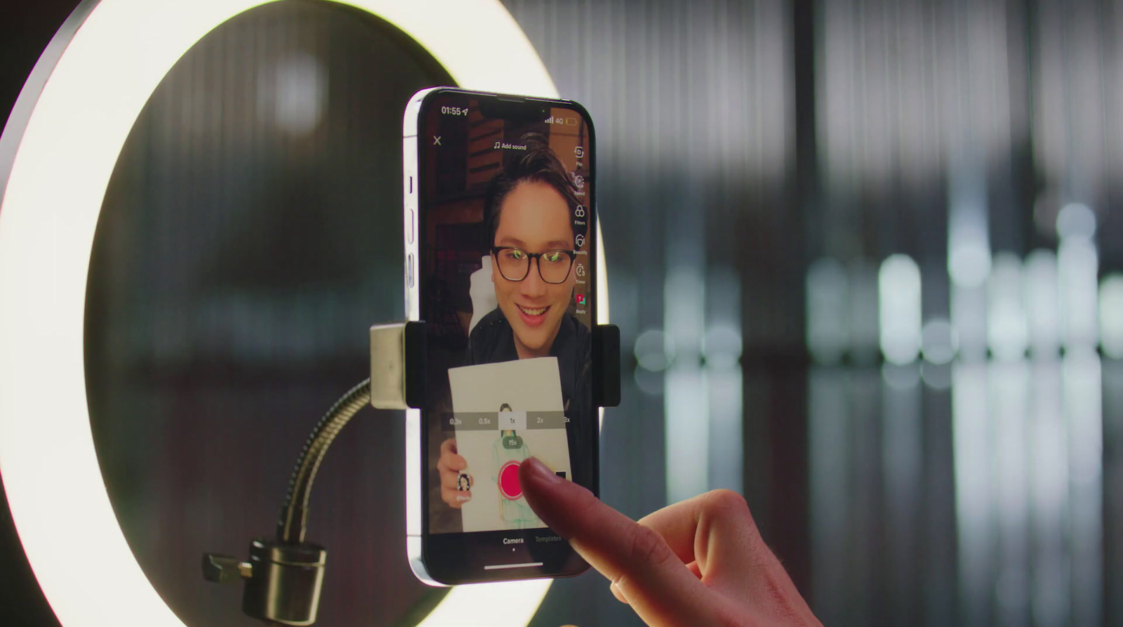 a person holding a cell phone in front of a mirror