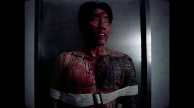 a man with blood all over his body and chest