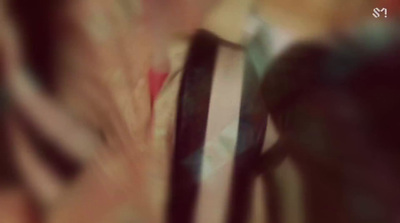 a blurry photo of a person's head with a tie