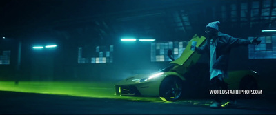 a man standing next to a sports car