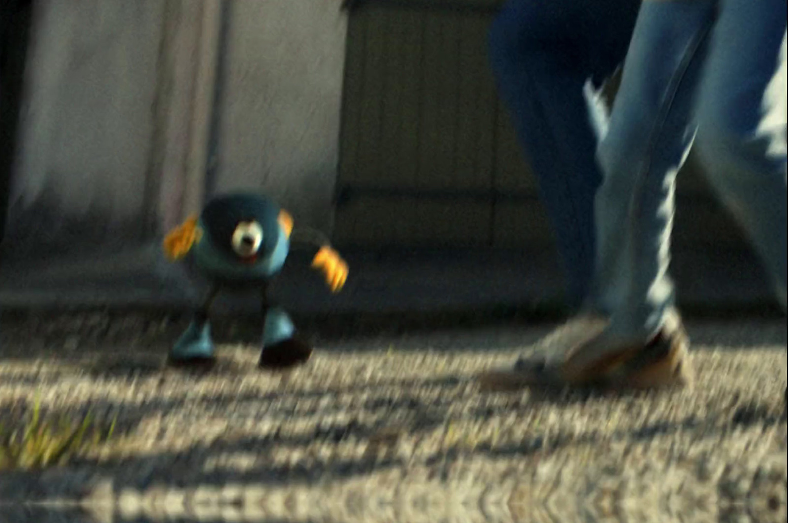 a close up of a person walking with a toy