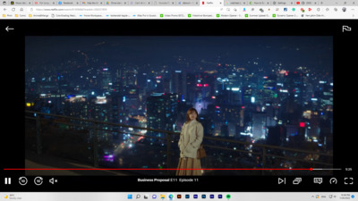 a woman standing on top of a tall building