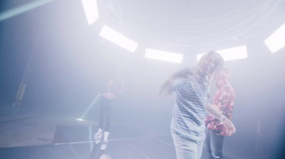 a couple of people standing on top of a stage