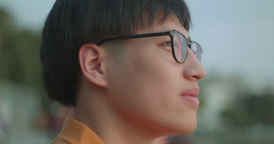 a close up of a person wearing glasses