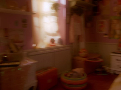 a blurry photo of a child's room with a window