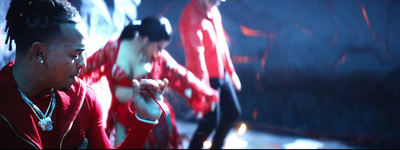 a group of young people dancing in a dark room