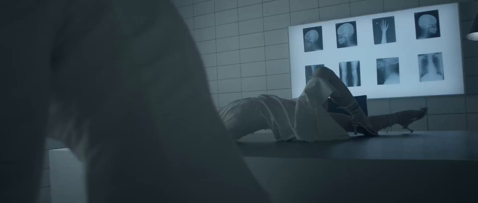 a person laying on a counter in a room