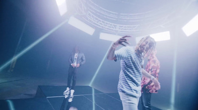 a group of people standing on top of a stage