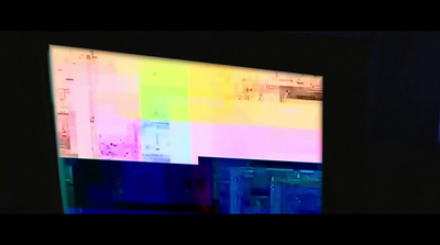 a television screen with a multicolored pattern on it