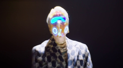 a man with a neon mask on his face