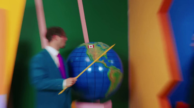 a man in a blue suit is holding a flag