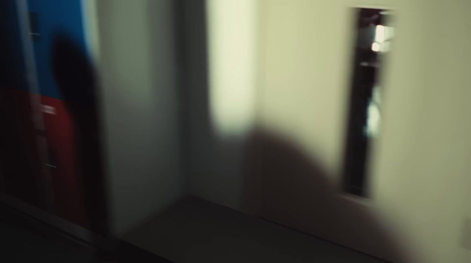 a blurry photo of a room with a door