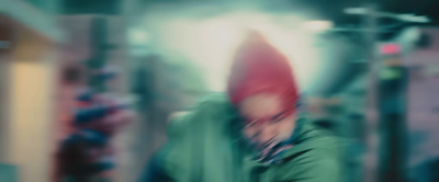 a blurry photo of a man wearing a red hat