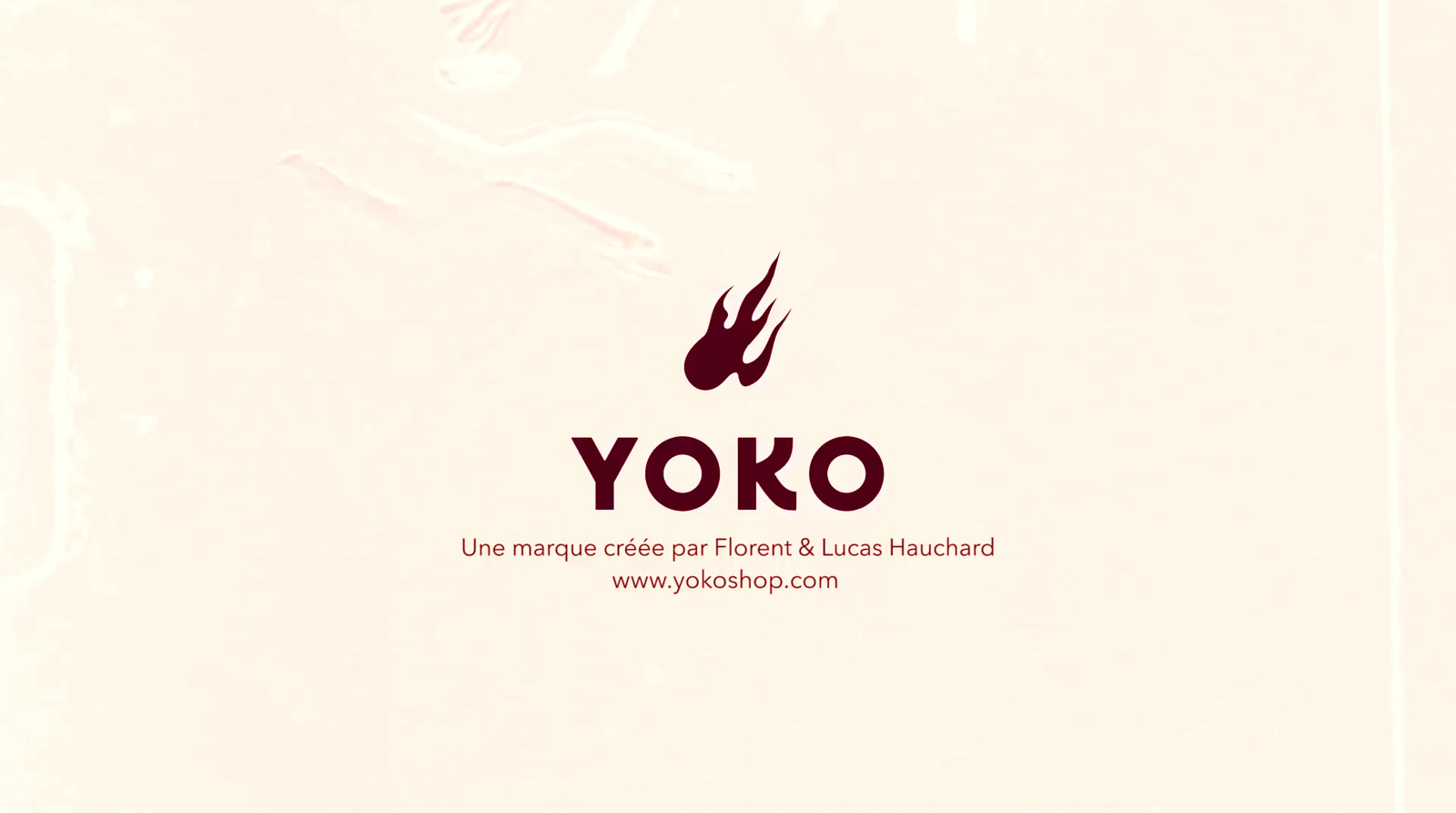 a red yoko logo on a white background