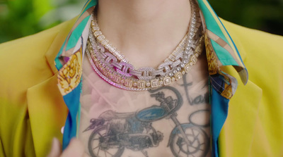 a close up of a person wearing a necklace