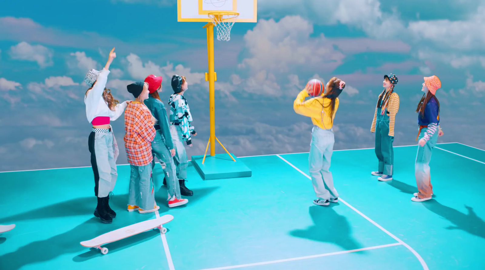 a group of people standing on top of a basketball court