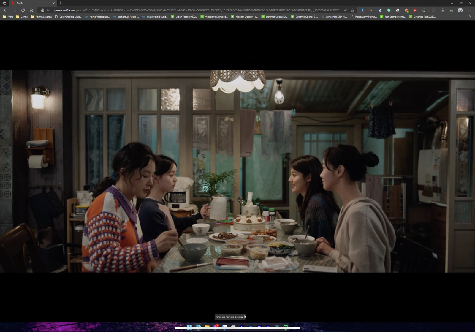 a group of women sitting around a table eating food