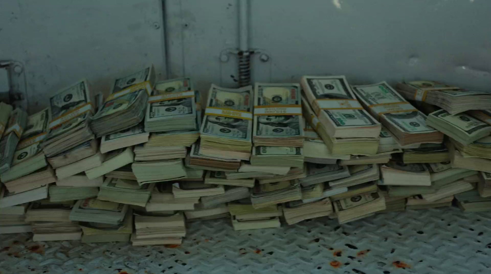 a pile of money sitting on top of a floor