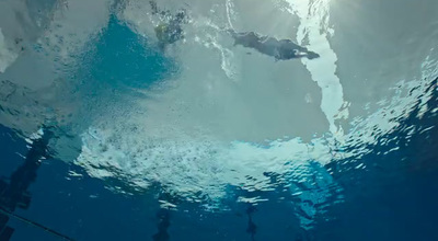 a group of people swimming in a large body of water