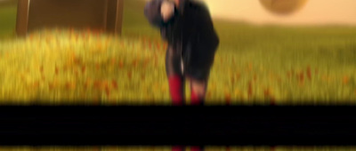 a blurry image of a person standing in a field