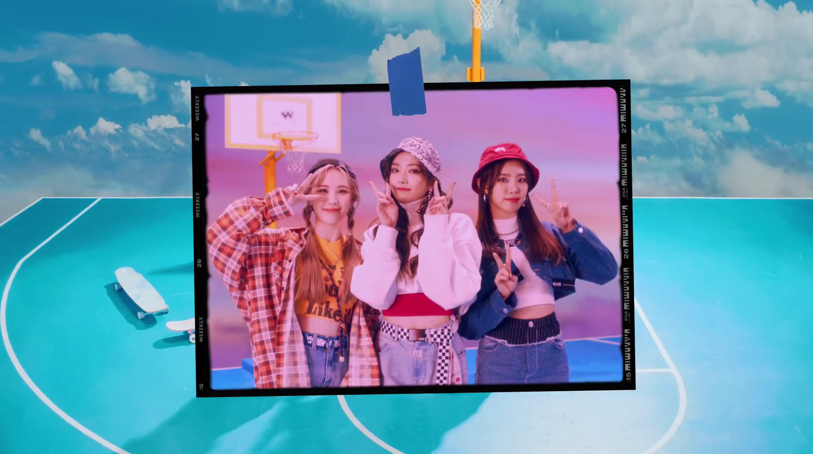 a group of young women standing on top of a basketball court