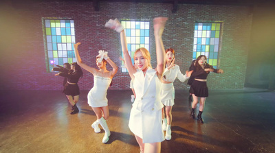 a group of young women dancing on a stage