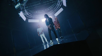 a group of people standing on top of a stage