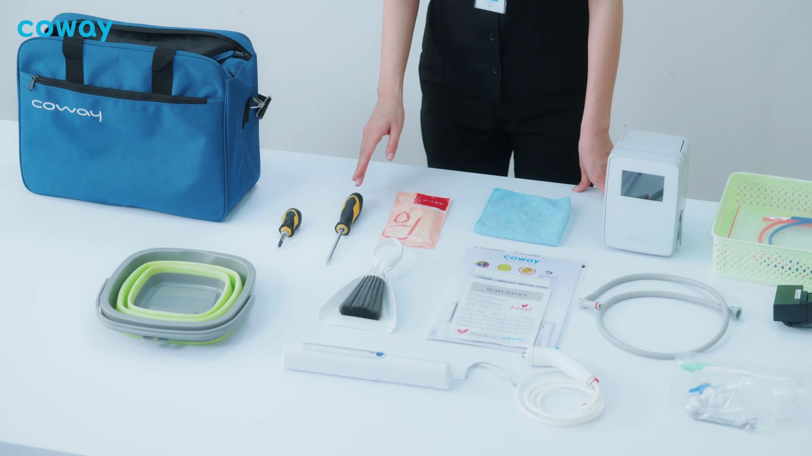 a person standing next to a table with a bag on it