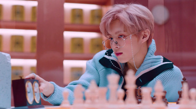 a young man playing a game of chess