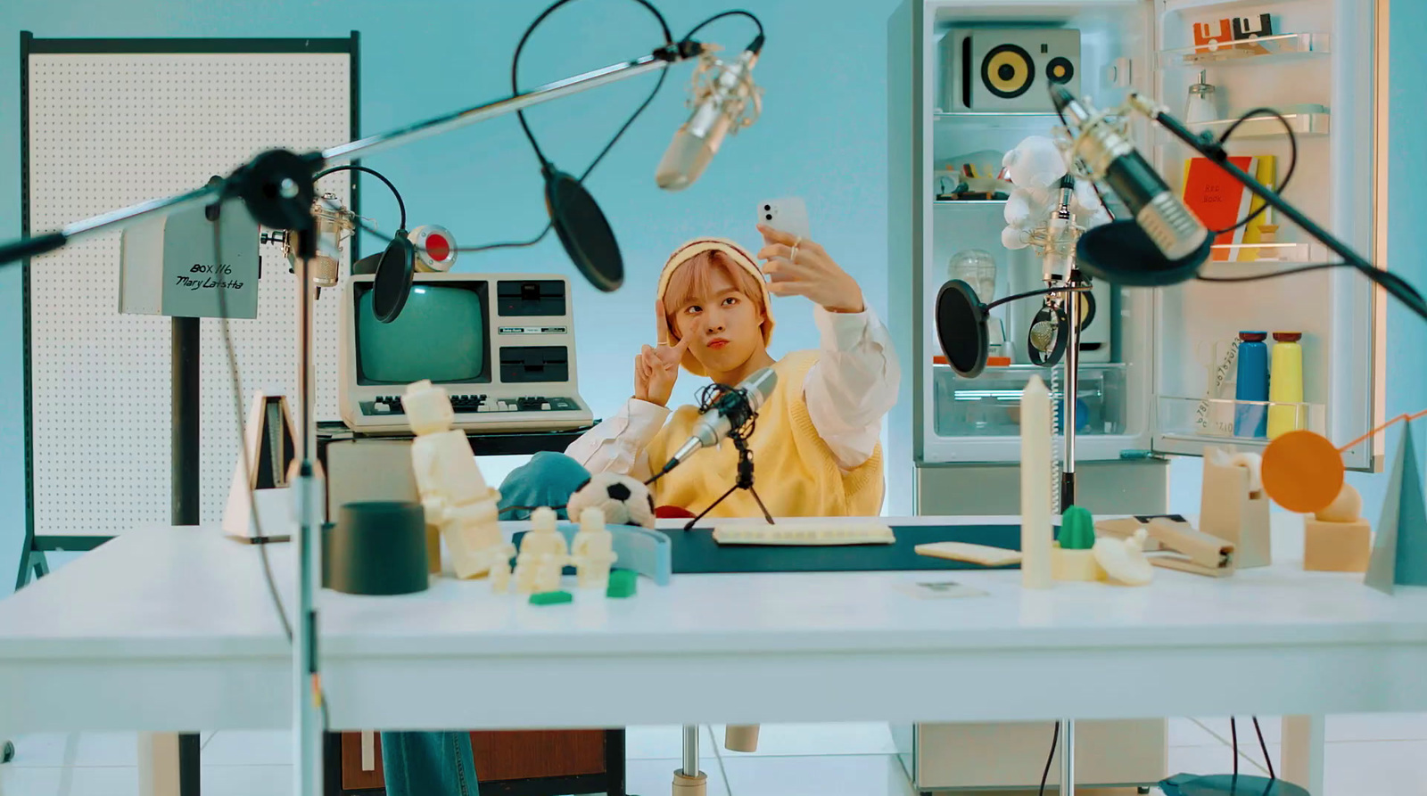 a woman sitting at a desk in a room