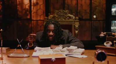 a man sitting at a table with a lot of papers