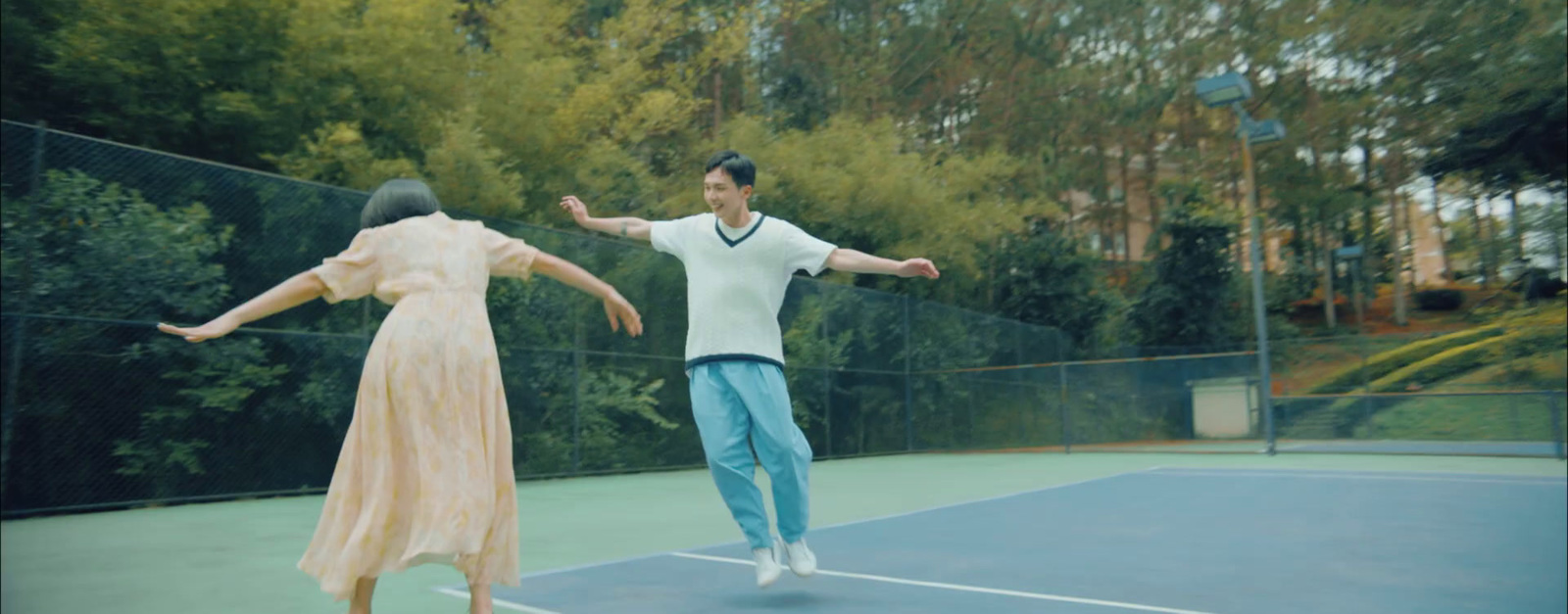 a man and a woman on a tennis court