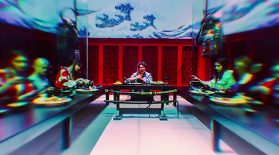 a blurry photo of a man sitting at a table