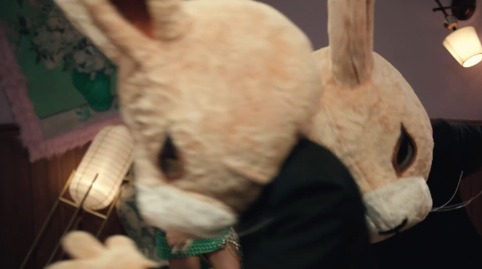 a person holding a stuffed animal in a room